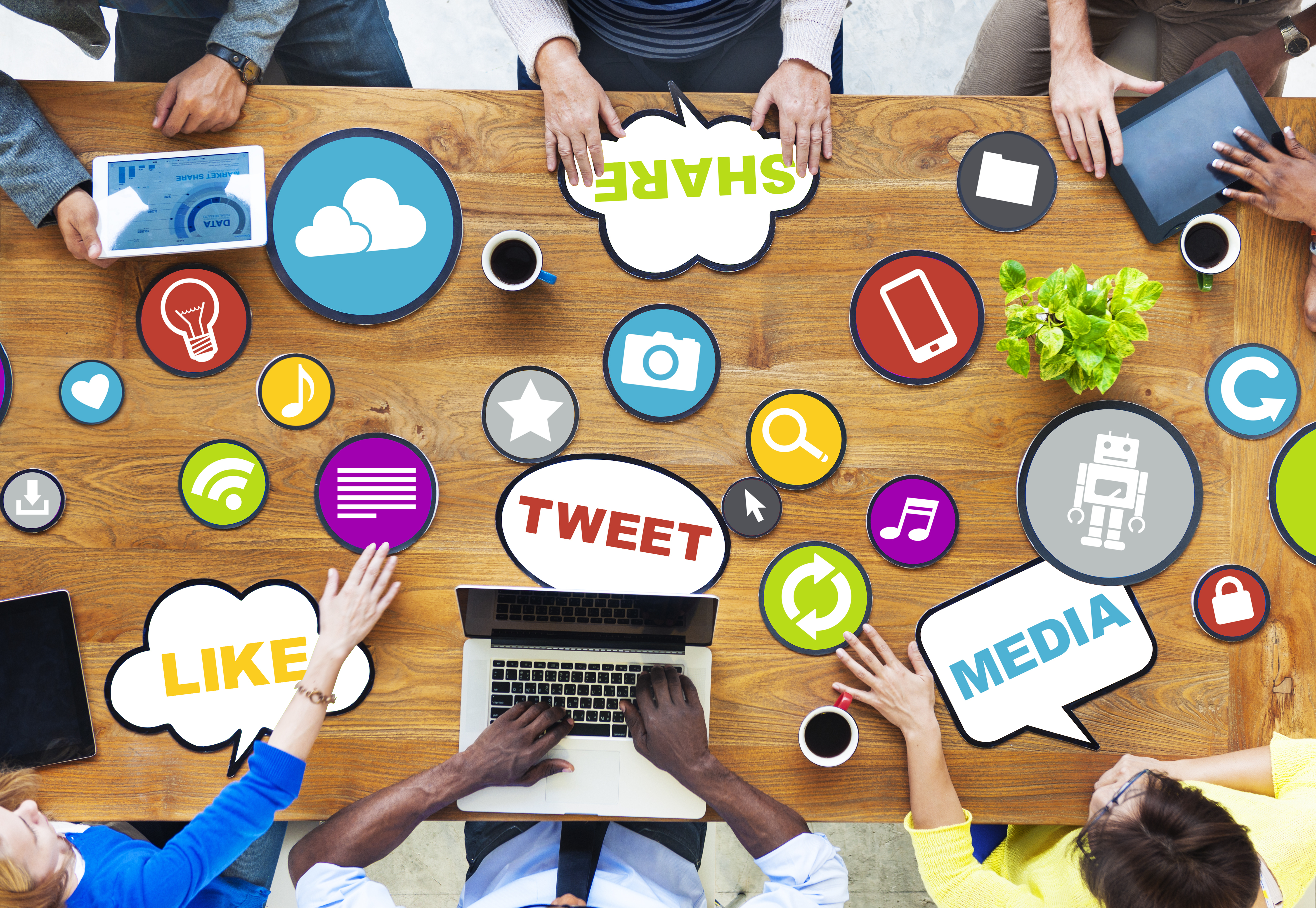 people gathered around a table discussing social media marketing